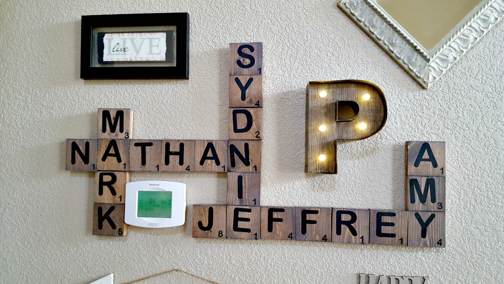diy scrabble family names on wall